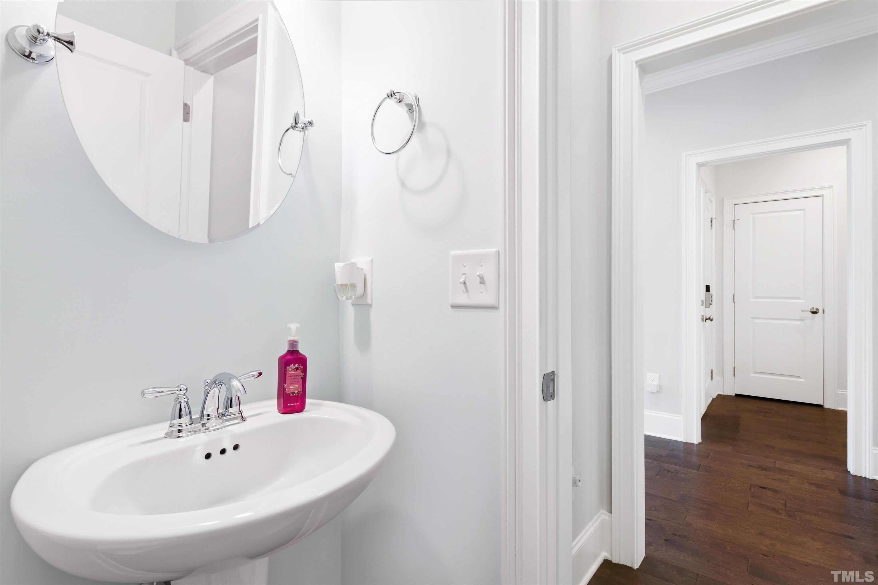 4121 Olde Judd Drive Willow Spring, NC 27592 - Photo 53 of 61 a bathroom with a sink and mirror