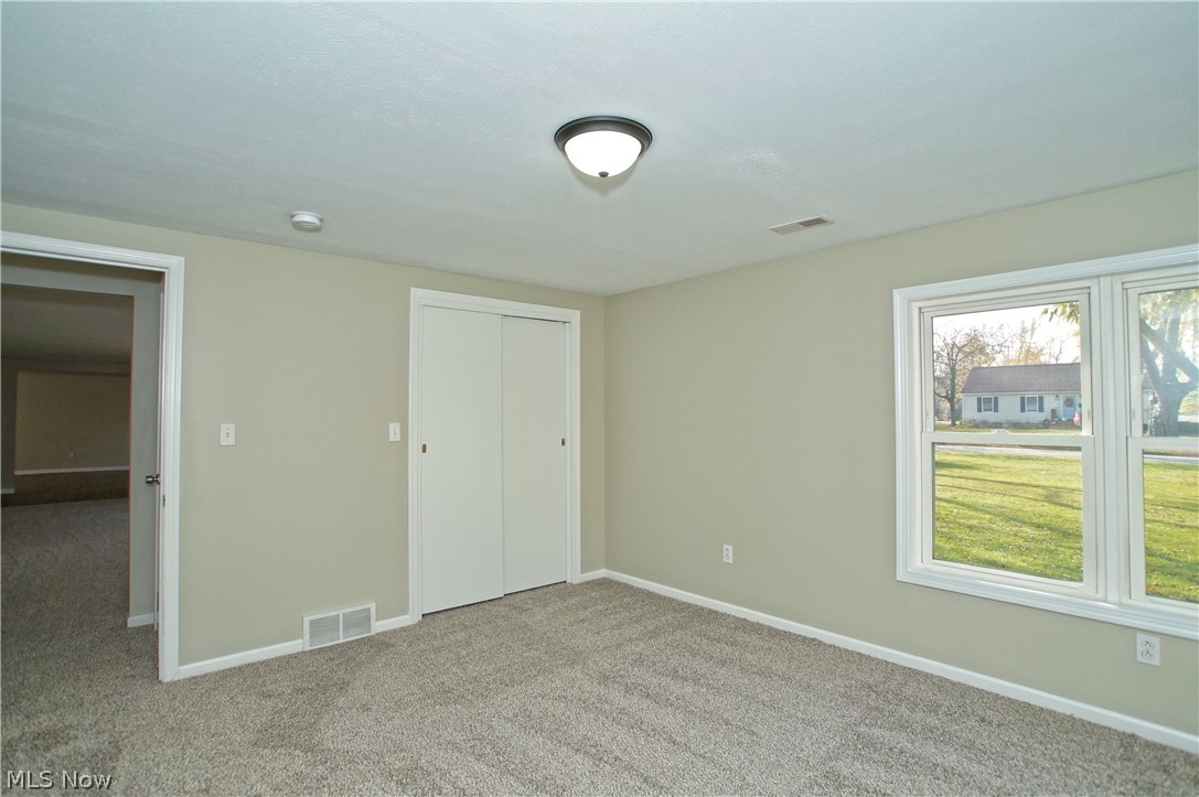 8063 Middlesex Road Mentor, OH 44060 - Photo 13 of 35 The front bedroom is light-filled and large.
