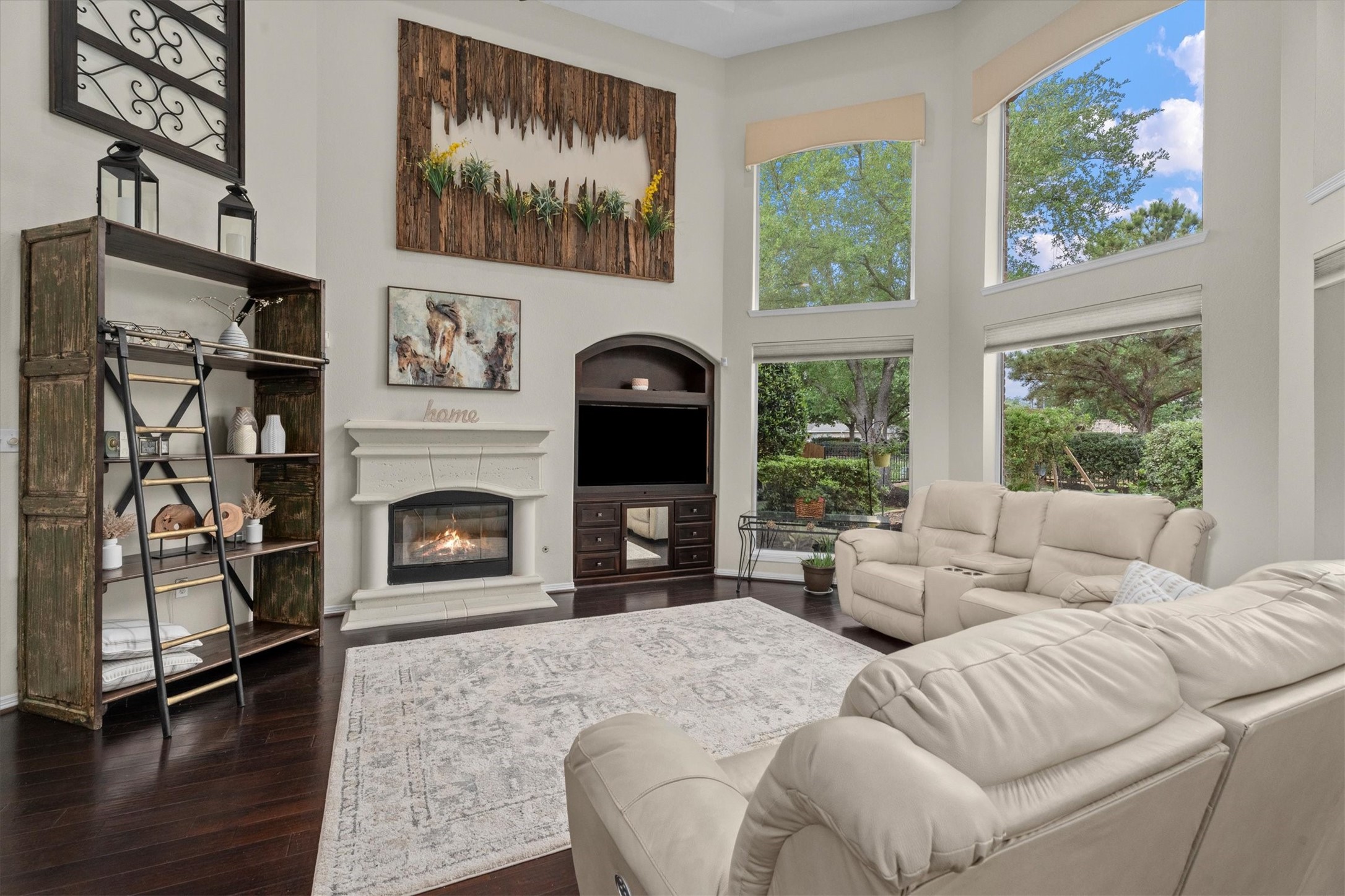 9822 Prairie Clover Lane Spring, TX 77379 - Photo 13 of 46 a living room with furniture a fireplace and a floor to ceiling window