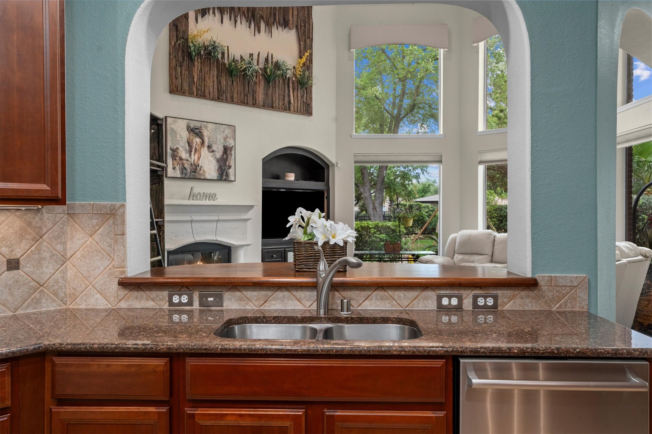 9822 Prairie Clover Lane Spring, TX 77379 - Photo 20 of 46 a kitchen with a sink and a window