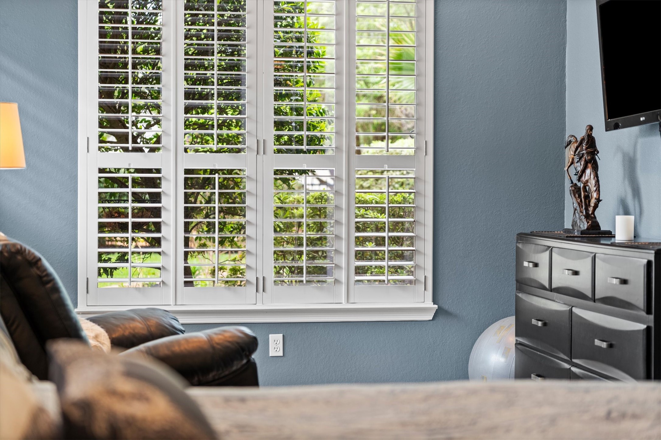 9822 Prairie Clover Lane Spring, TX 77379 - Photo 22 of 46 a living room with furniture and a flat screen tv