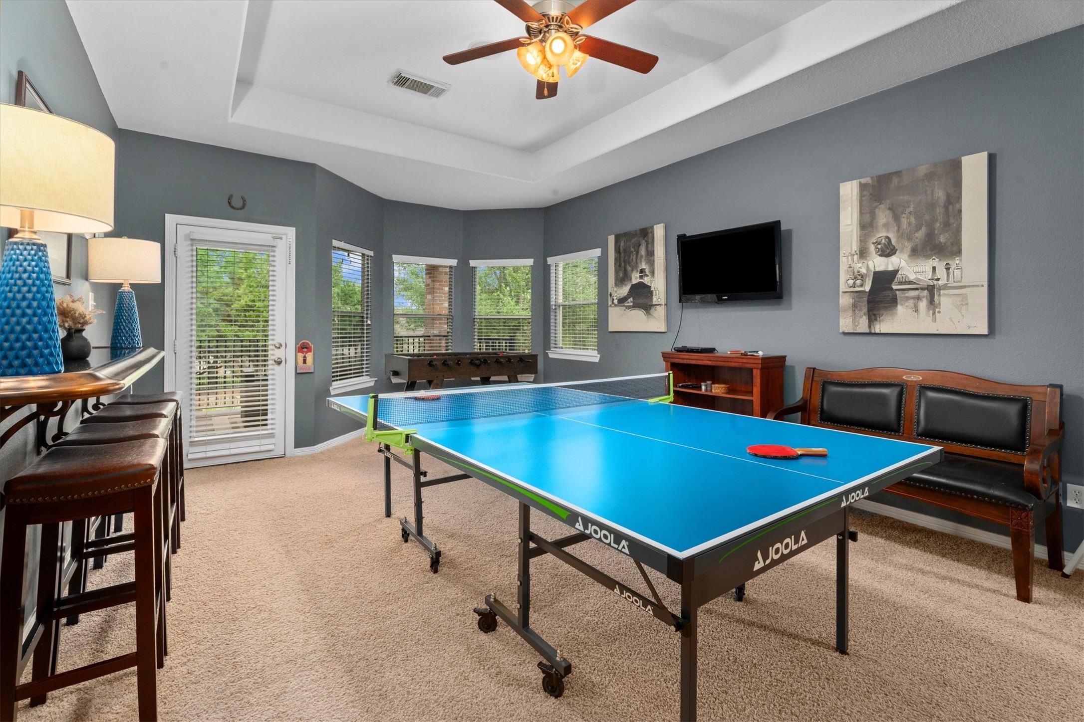 9822 Prairie Clover Lane Spring, TX 77379 - Photo 25 of 46 a living room with furniture pool table and a flat screen tv