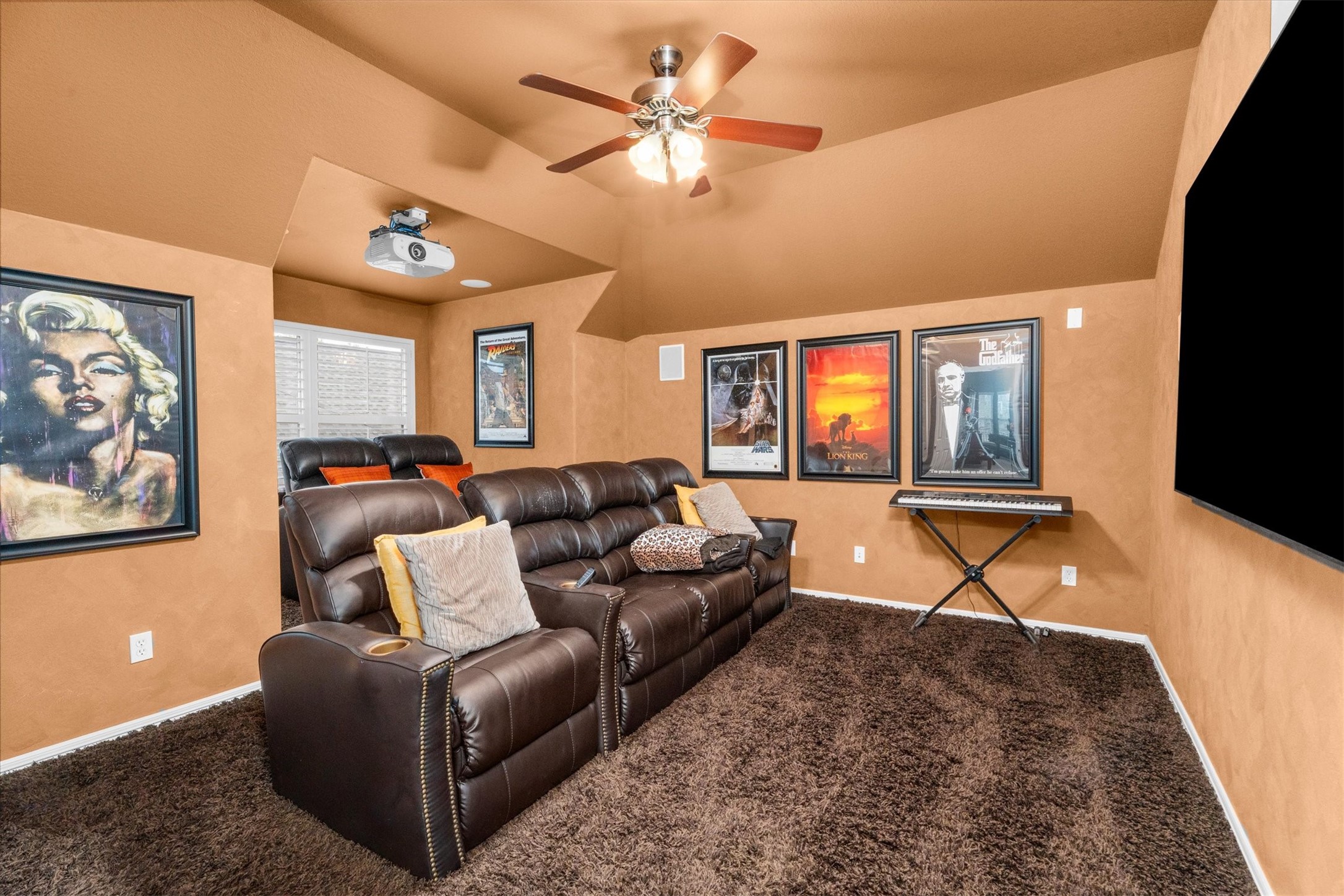 9822 Prairie Clover Lane Spring, TX 77379 - Photo 26 of 46 a living room with furniture a flat screen tv and a fireplace