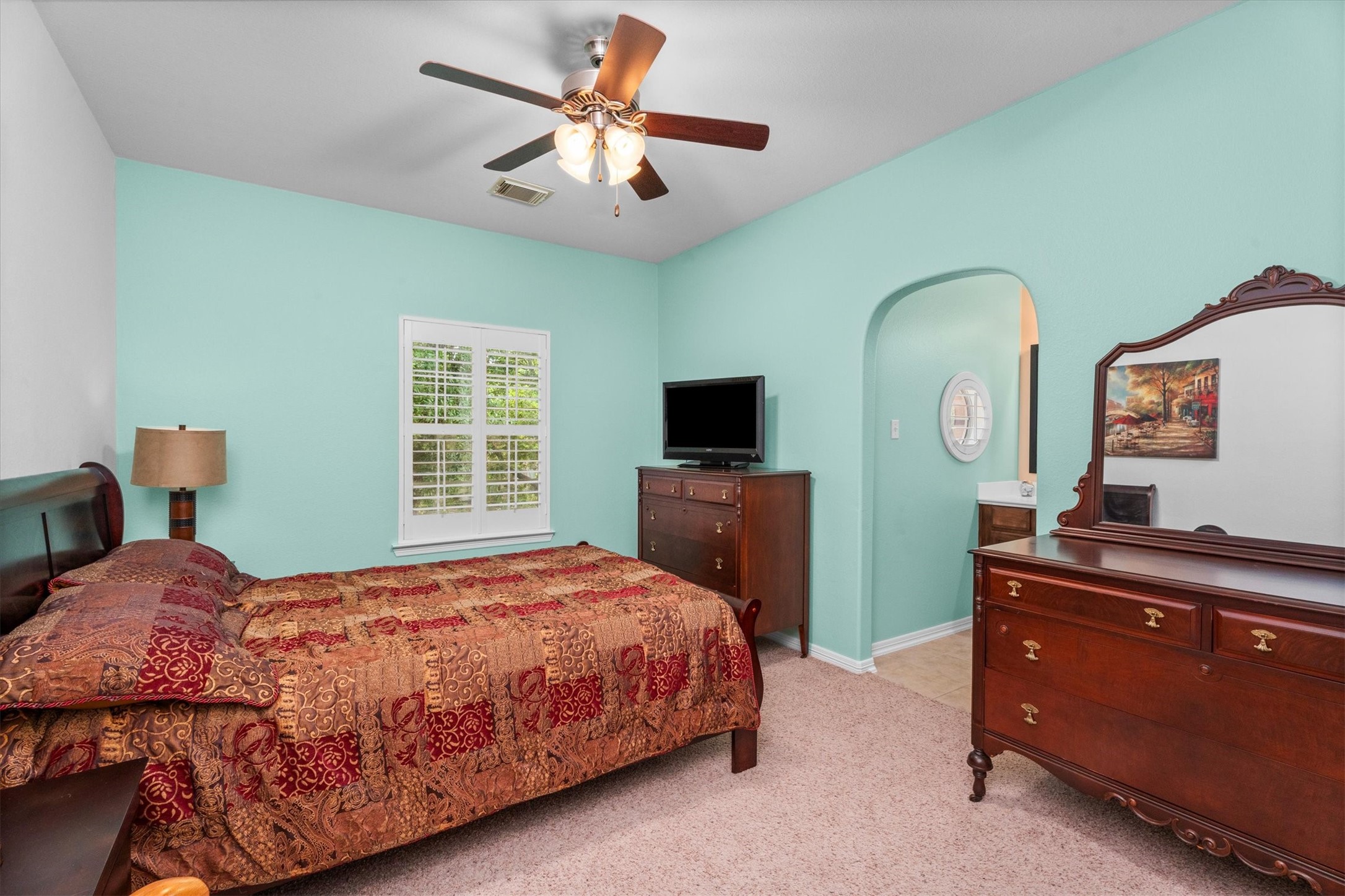 9822 Prairie Clover Lane Spring, TX 77379 - Photo 31 of 46 a bedroom with a bed and a flat screen tv