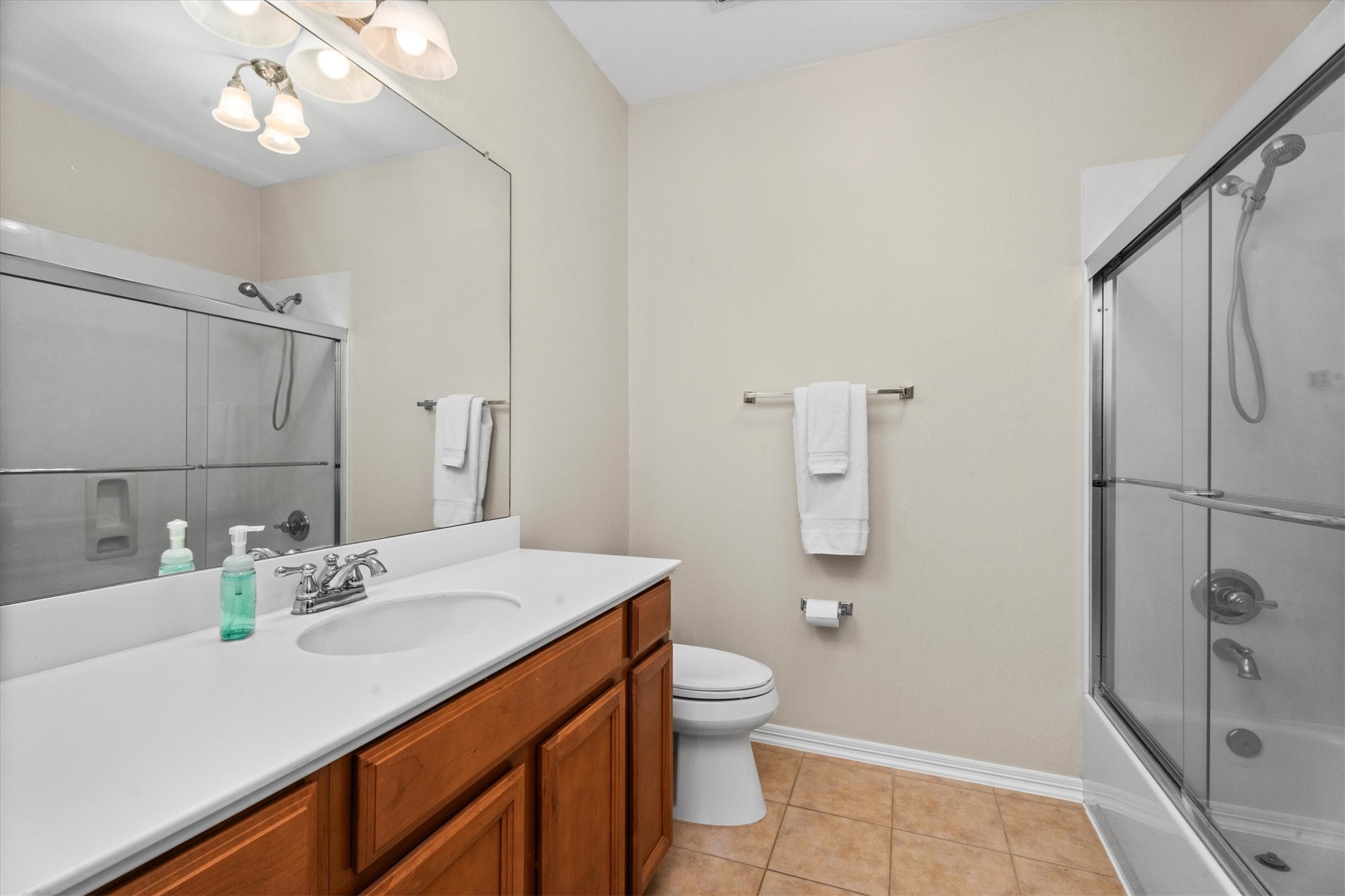 9822 Prairie Clover Lane Spring, TX 77379 - Photo 36 of 46 a bathroom with a sink a toilet and shower