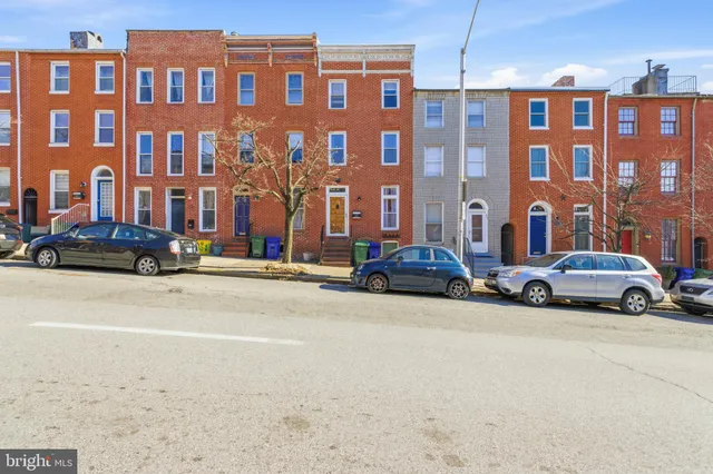 a view of a street with cars