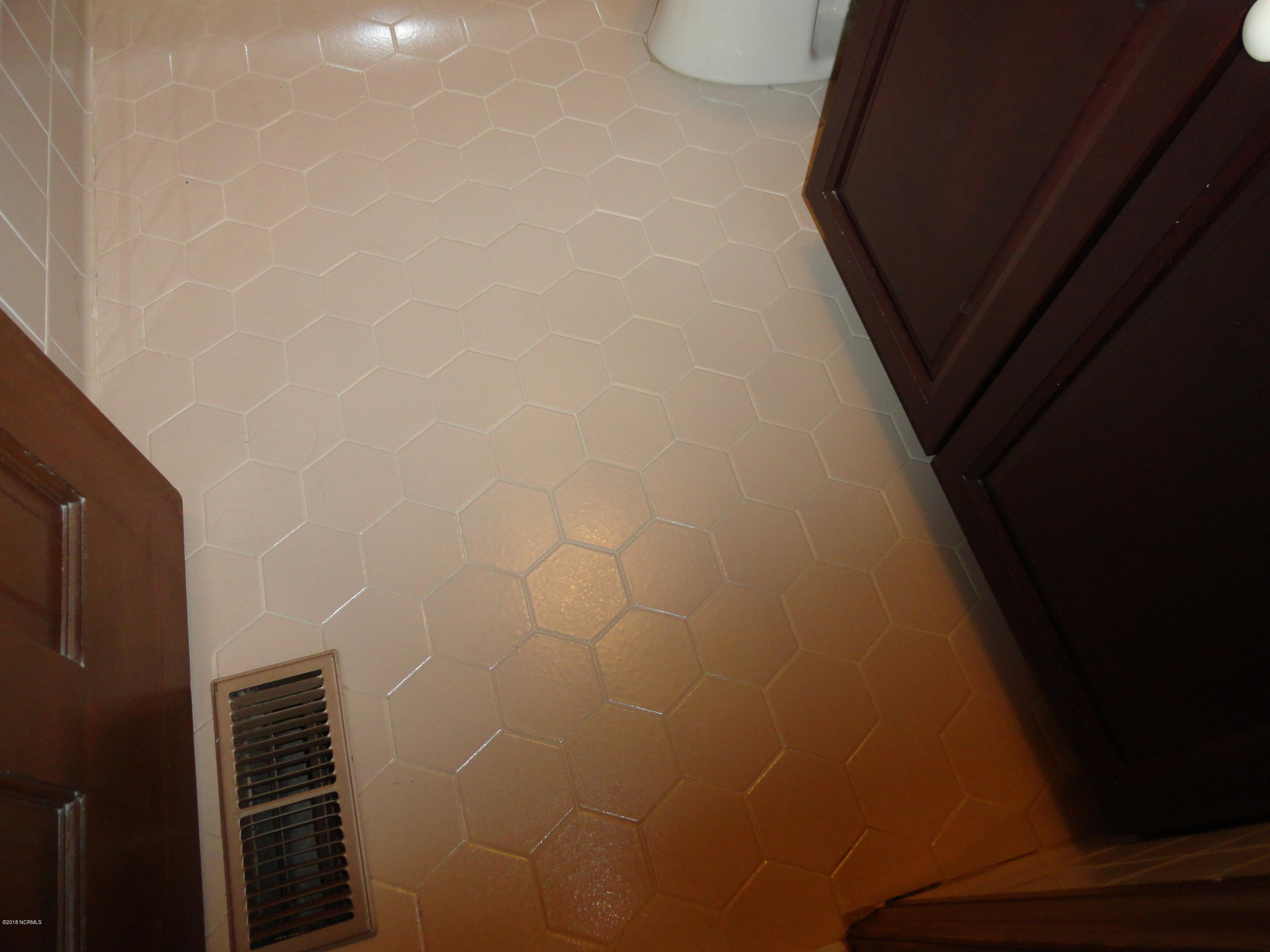 222 Snead Road New Bern, NC 28560 - Photo 26 of 35 Tile Floor in the Hall Bath