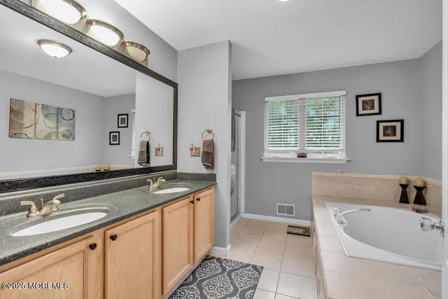 a bath room with a sink and a bathtub