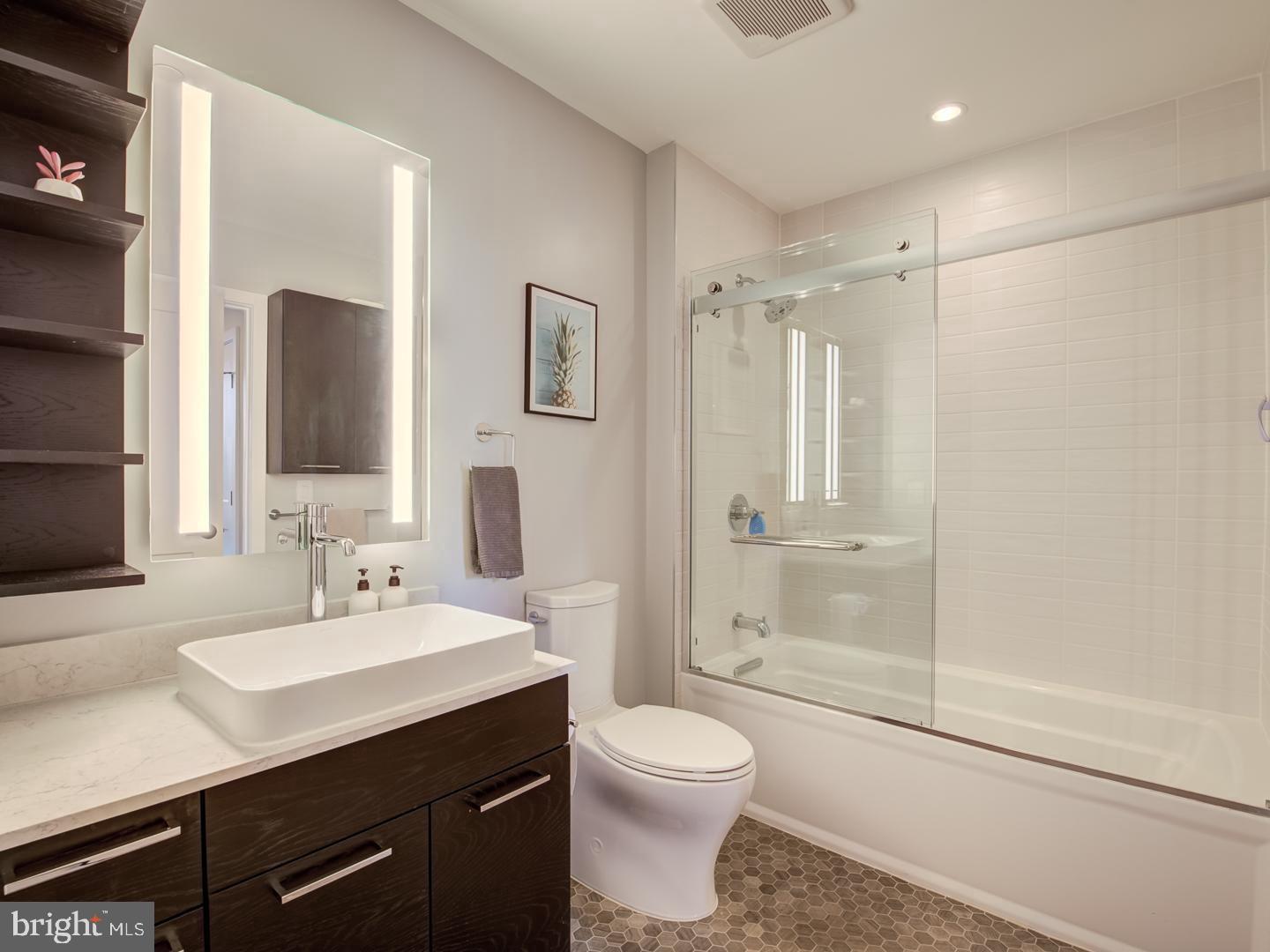 70 N Street Southeast, Unit N607 Washington, DC 20003 - Photo 17 of 21 a bathroom with a sink a toilet and shower