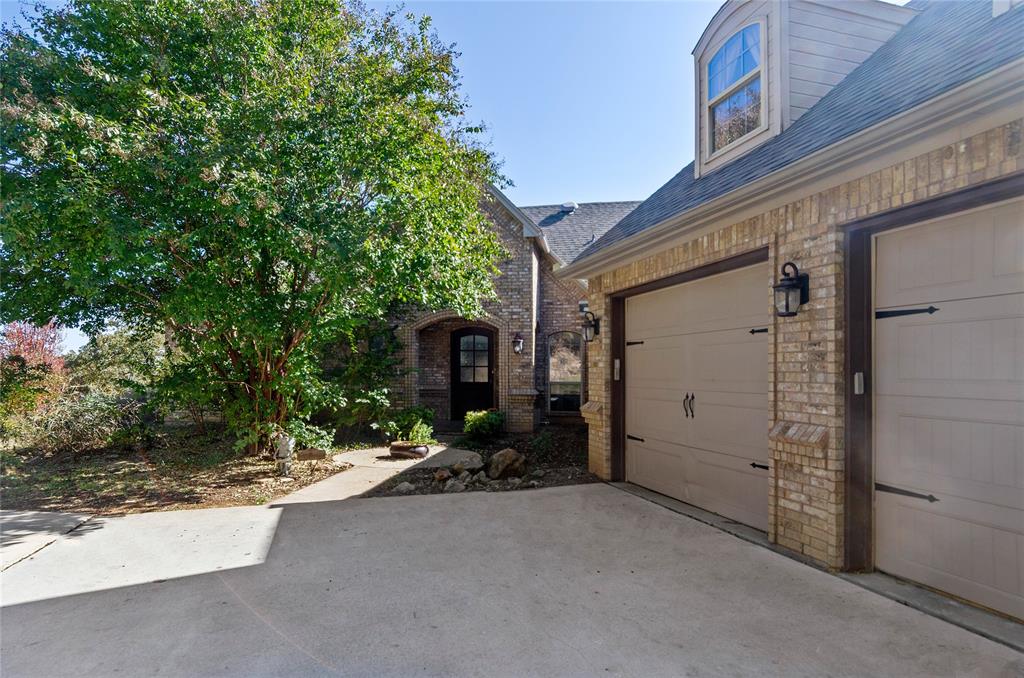 396 Ranchview Court Bowie, TX 76230 - Photo 25 of 38 a view of a house with a tree
