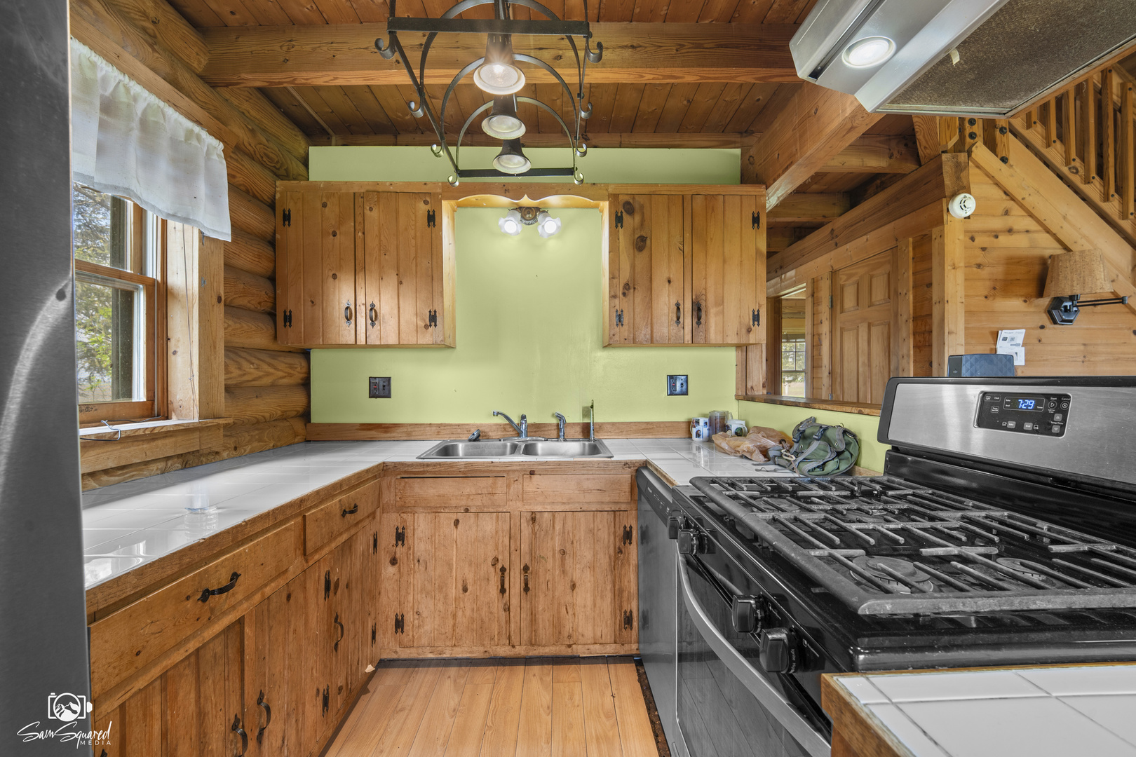 1235 North 1450 East Road Onarga, IL 60955 - Photo 21 of 34 a kitchen with a stove a sink and a refrigerator