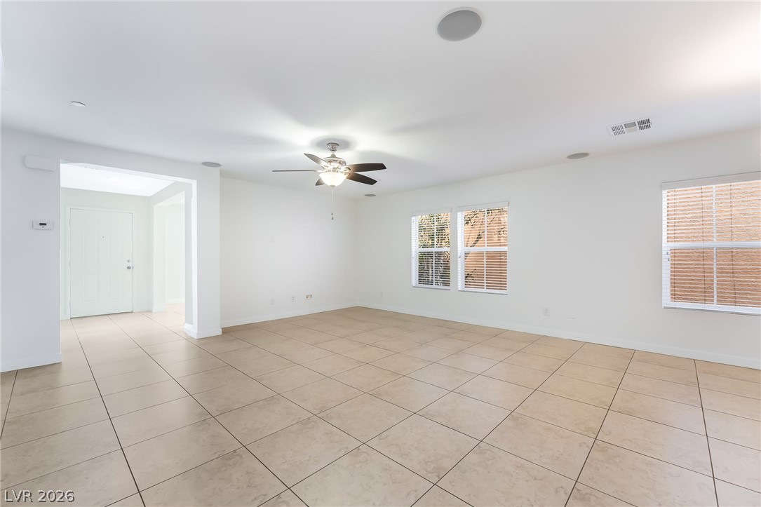 3052 Camino Rico Avenue Henderson, NV 89044 - Photo 11 of 39 Unfurnished room featuring a ceiling fan and light tile patterned floors