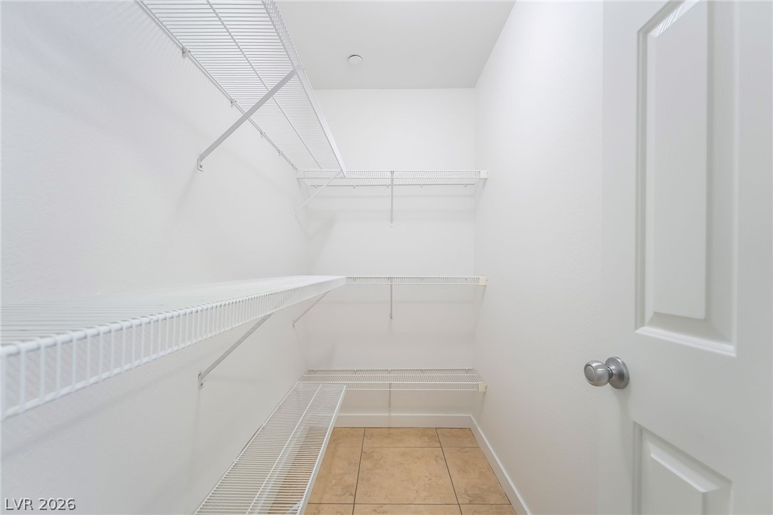 3052 Camino Rico Avenue Henderson, NV 89044 - Photo 18 of 39 Walk in closet with light tile patterned flooring