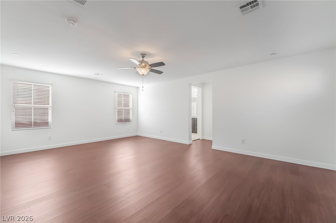 3052 Camino Rico Avenue Henderson, NV 89044 - Photo 21 of 39 Unfurnished room featuring dark wood-style flooring and ceiling fan