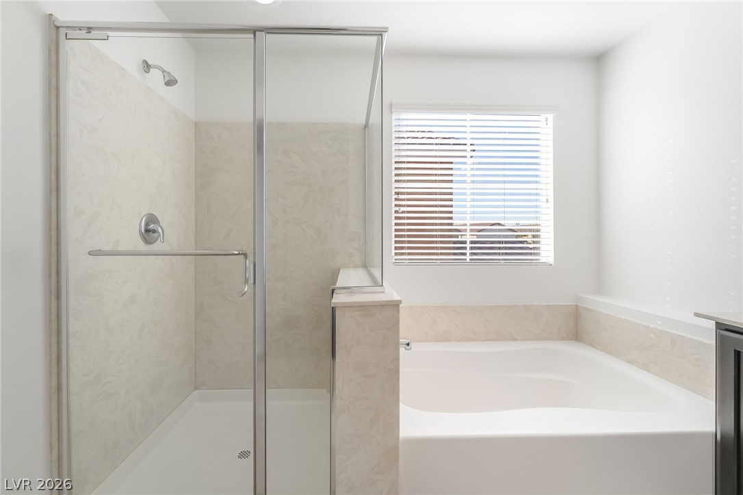 3052 Camino Rico Avenue Henderson, NV 89044 - Photo 25 of 39 Bathroom featuring a garden tub, a shower stall, and vanity