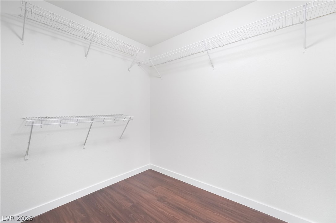 3052 Camino Rico Avenue Henderson, NV 89044 - Photo 26 of 39 Walk in closet with dark wood-type flooring