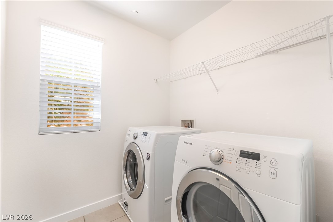 3052 Camino Rico Avenue Henderson, NV 89044 - Photo 29 of 39 Laundry room featuring independent washer and dryer and light tile patterned flooring
