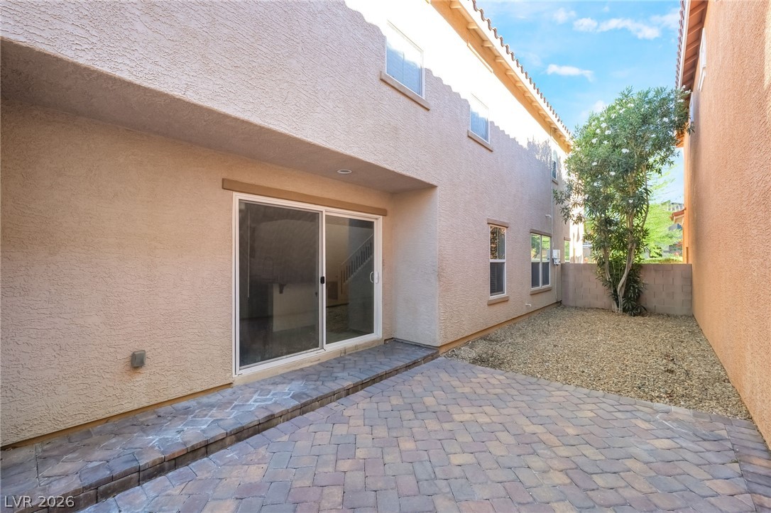 3052 Camino Rico Avenue Henderson, NV 89044 - Photo 36 of 39 Back of property featuring a patio and stucco siding