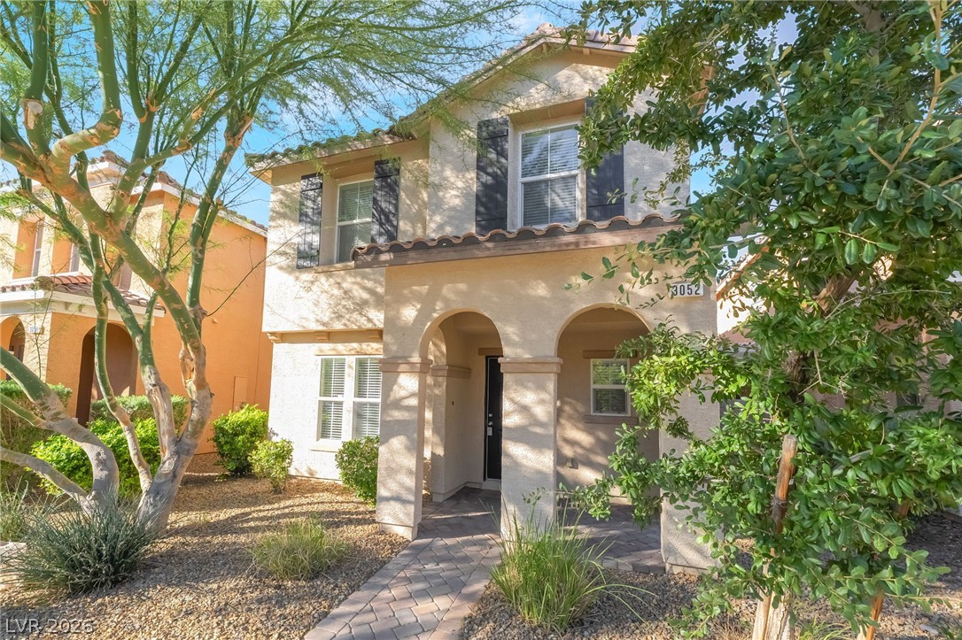 3052 Camino Rico Avenue Henderson, NV 89044 - Photo 4 of 39 Mediterranean / spanish-style house with a tile roof and stucco siding
