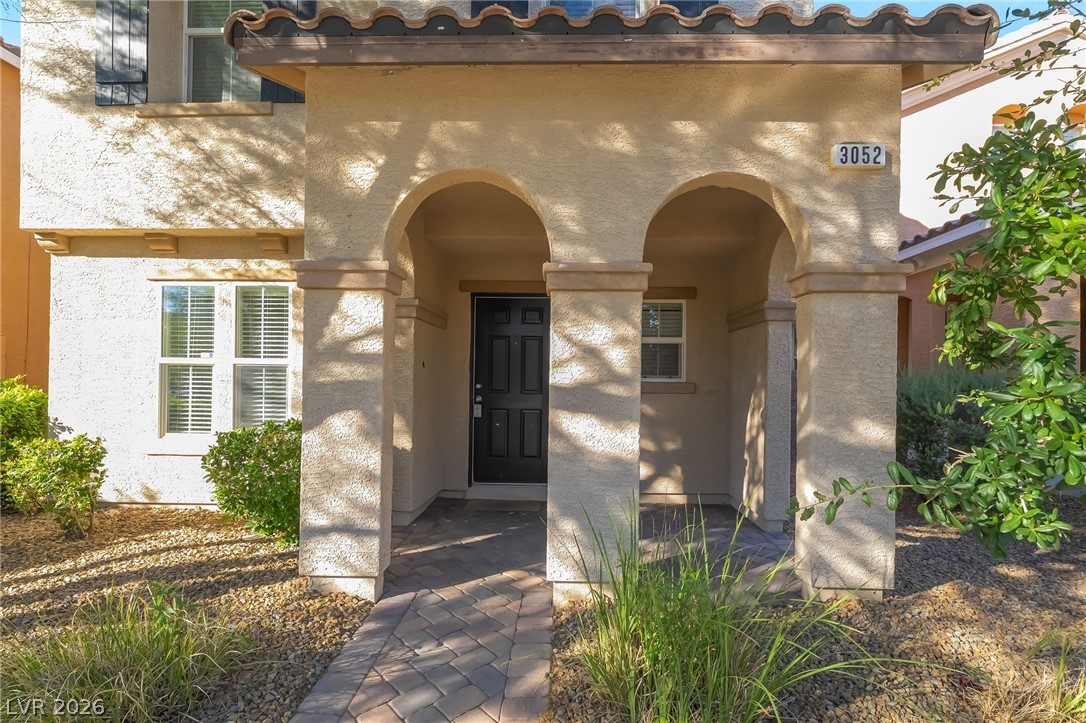3052 Camino Rico Avenue Henderson, NV 89044 - Photo 5 of 39 Entrance to property with stucco siding and a tile roof