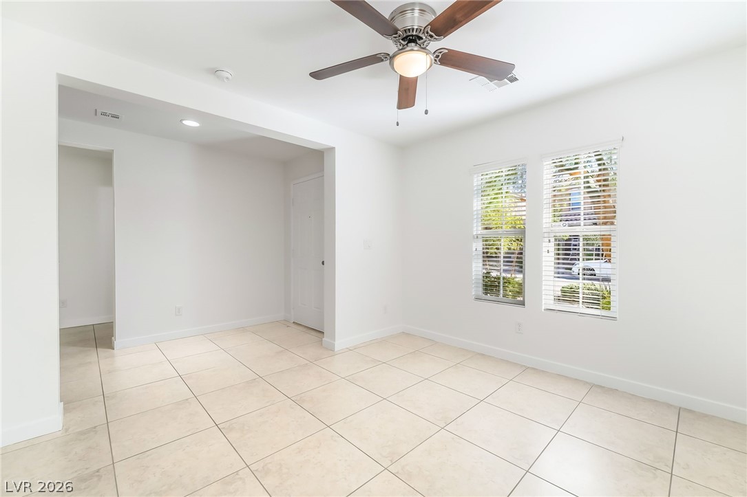 3052 Camino Rico Avenue Henderson, NV 89044 - Photo 6 of 39 Empty room with ceiling fan, light tile patterned floors, and recessed lighting