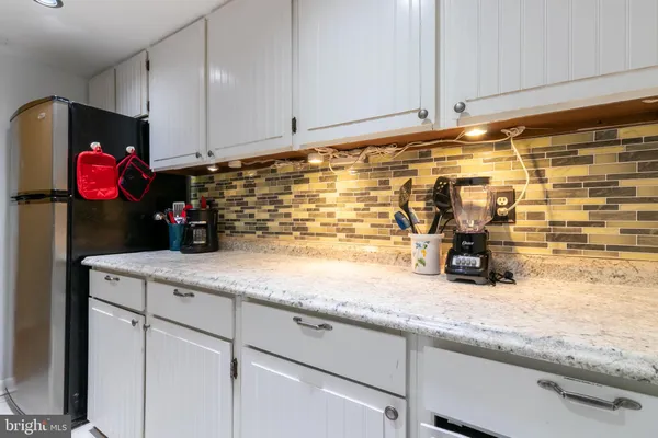 a kitchen with a sink and cabinets