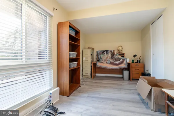 a bedroom with furniture and a window