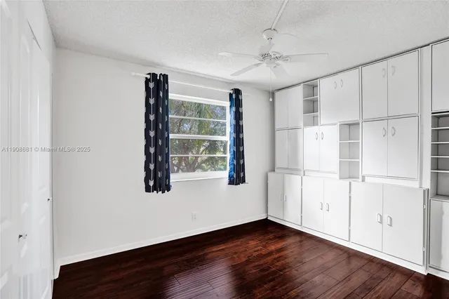 a view of a balcony with wooden floor