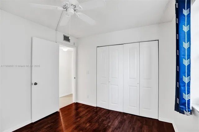 a view of a lake with a building in the background