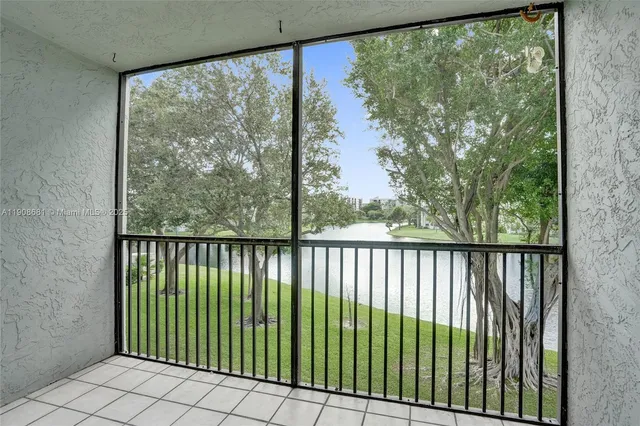 a view of a swimming pool with a table and chairs