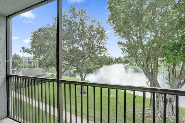 a view of building with swimming pool and outdoor space