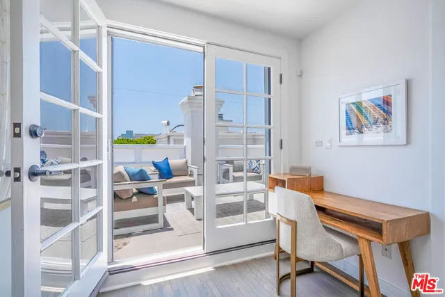 a view of a workspace with furniture