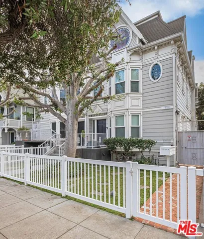 a front view of a house with a fence