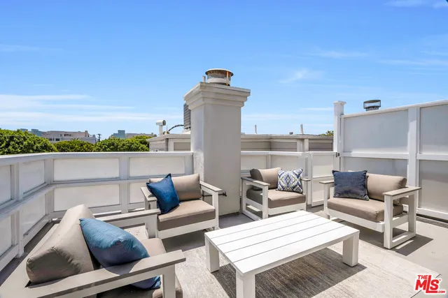 a view of a terrace with couches and a table