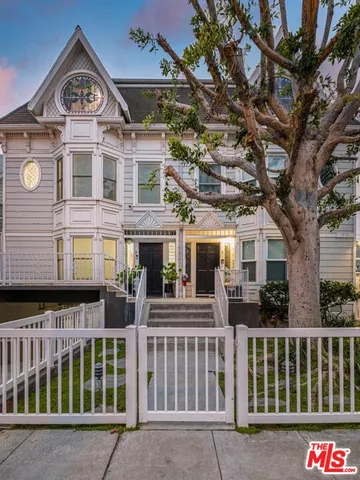 a front view of a building with large windows