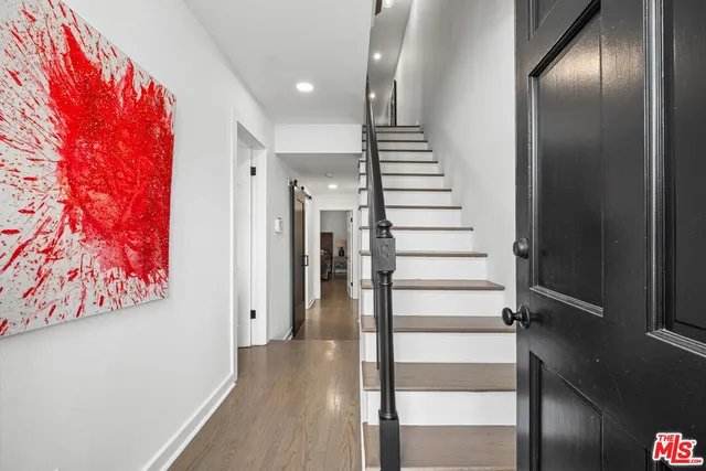 a view of entryway with wooden floor