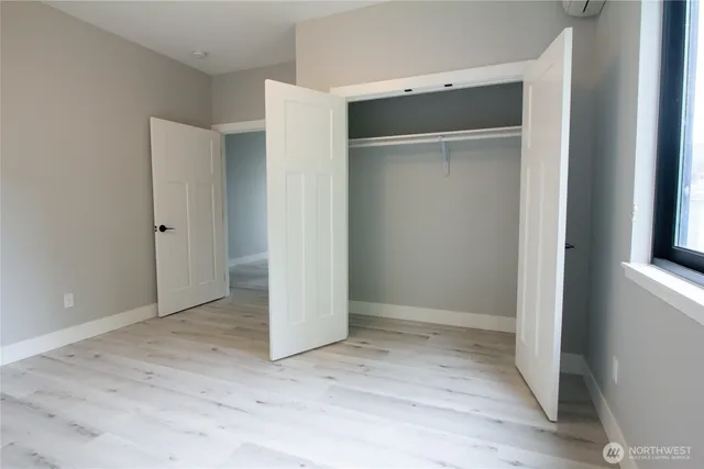 an empty room with wooden floor