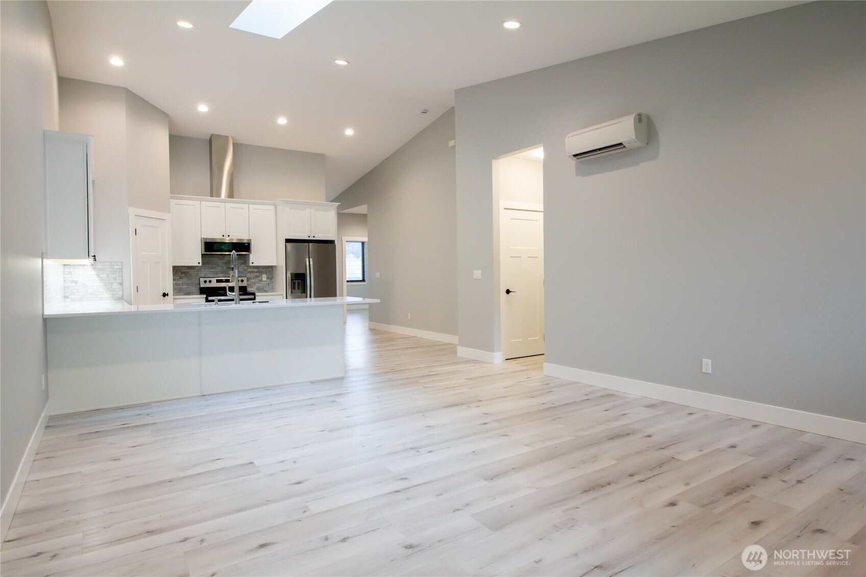 1037 Southeast Date Avenue, Unit 1 College Place, WA 99324 - Photo 20 of 24 a view of kitchen with kitchen island granite countertop stainless steel appliances refrigerator and microwave