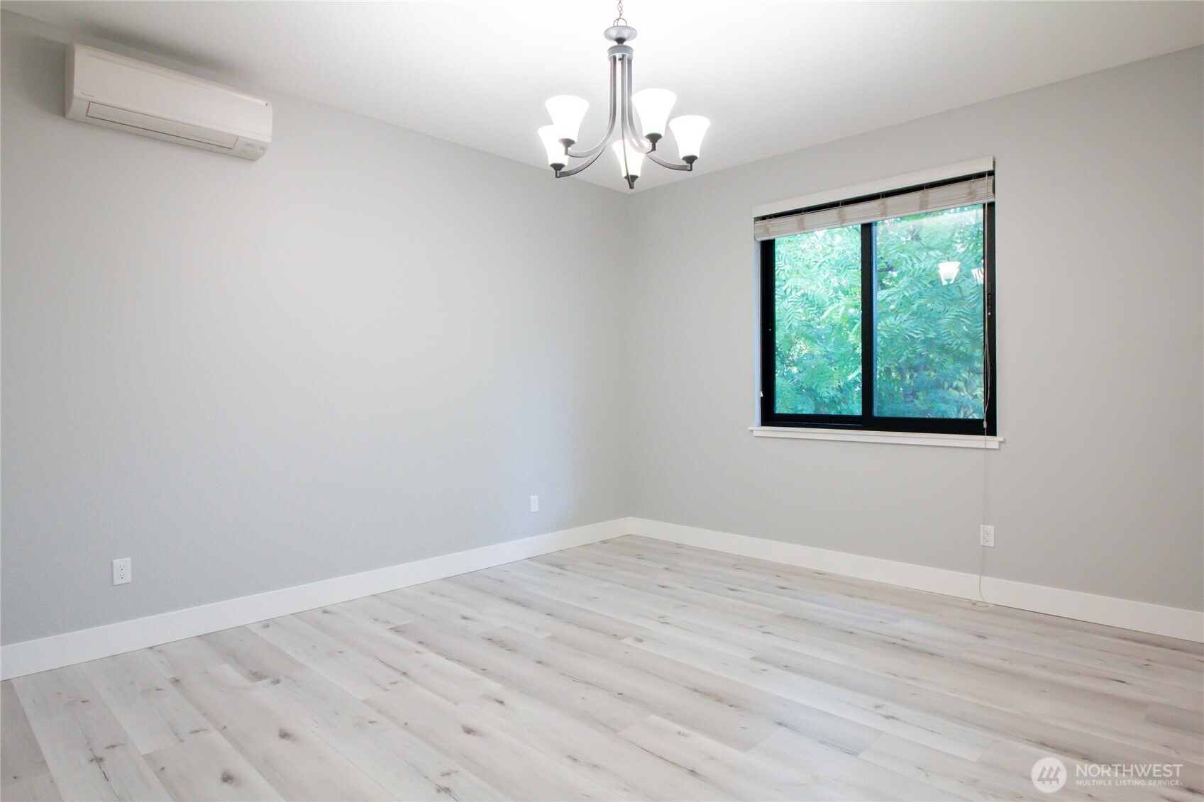 1037 Southeast Date Avenue, Unit 1 College Place, WA 99324 - Photo 21 of 24 a view of a room with wooden floor and windows