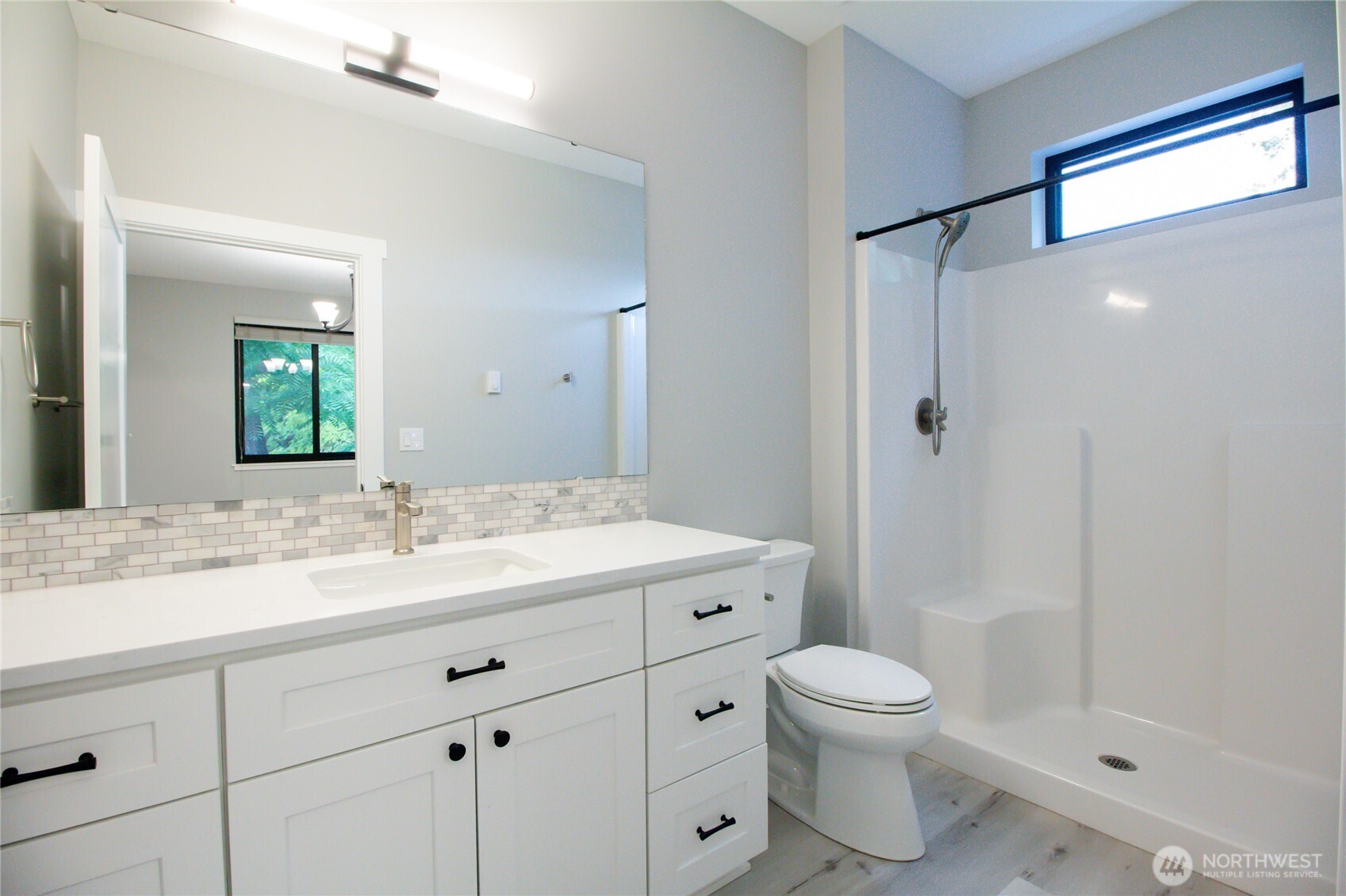 1037 Southeast Date Avenue, Unit 1 College Place, WA 99324 - Photo 23 of 24 a bathroom with a granite countertop sink toilet a shower and a mirror