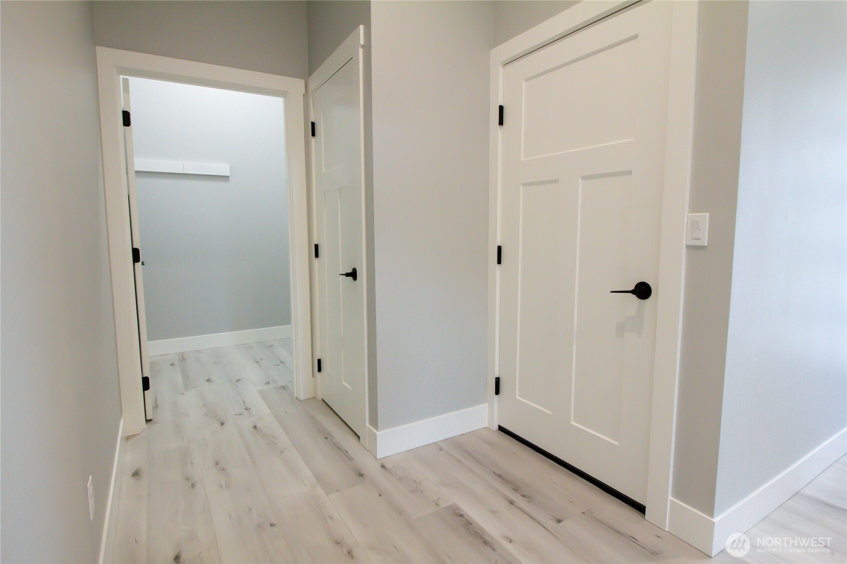 1037 Southeast Date Avenue, Unit 1 College Place, WA 99324 - Photo 7 of 24 a view of a hallway with wooden floor
