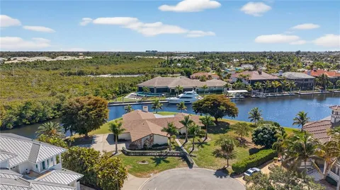 an aerial view of a house with a lake view
