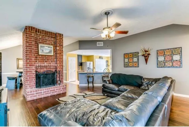 a living room with furniture and a fireplace