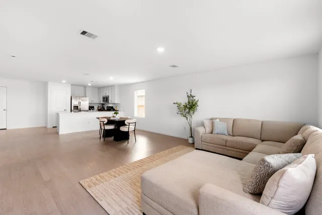 a living room with furniture and a couch