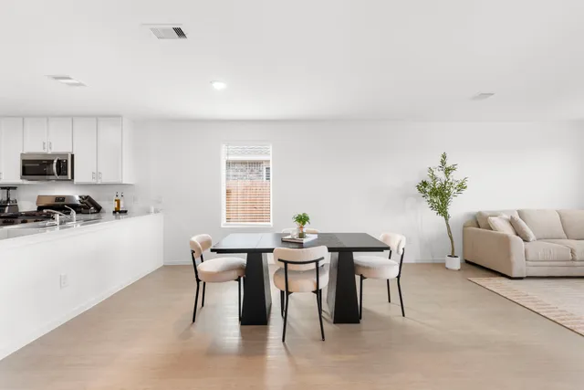 a view of a dining room with furniture