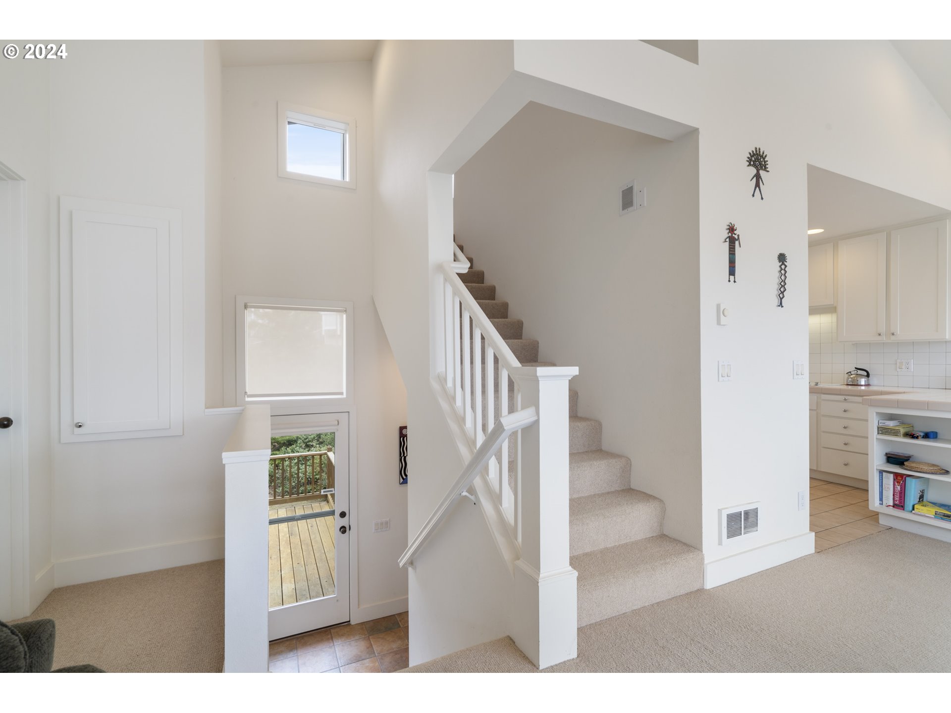 250 Capes Drive Oceanside, OR 97141 - Photo 12 of 38 a view of entryway and hall with wooden floor