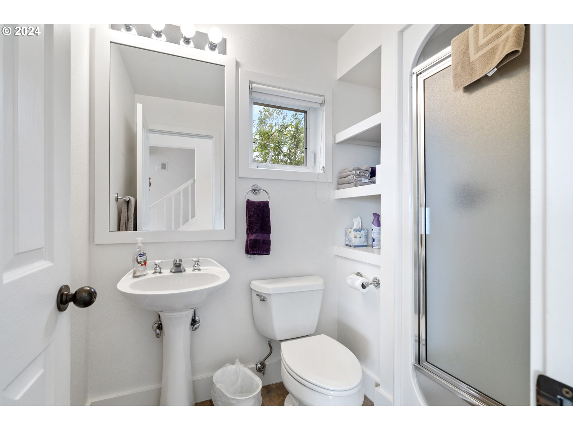 250 Capes Drive Oceanside, OR 97141 - Photo 13 of 38 a bathroom with a toilet sink and mirror