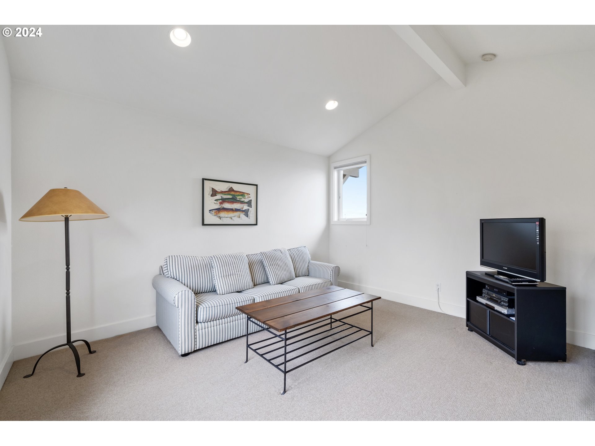 250 Capes Drive Oceanside, OR 97141 - Photo 14 of 38 a living room with furniture and a flat screen tv
