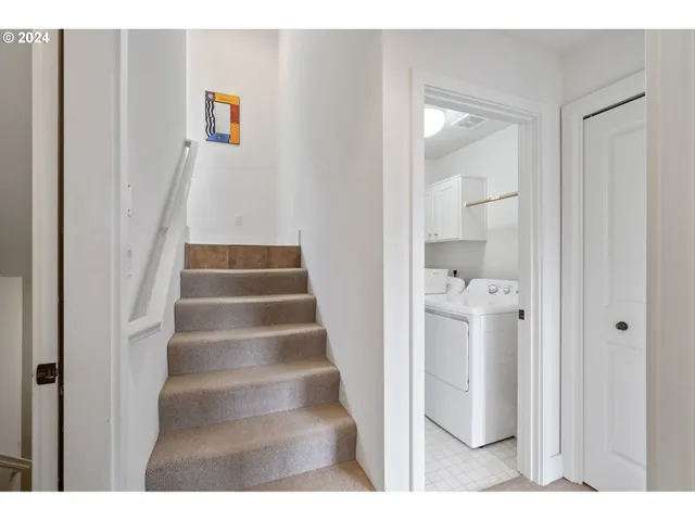 a bedroom with a bed and a lamp