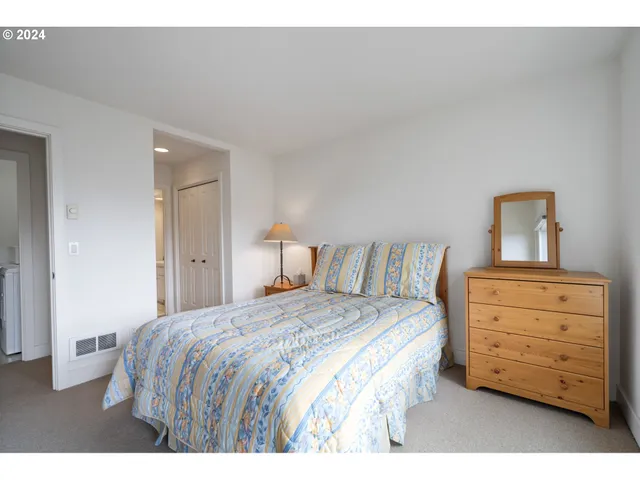 a bathroom with a sink toilet a mirror and vanity